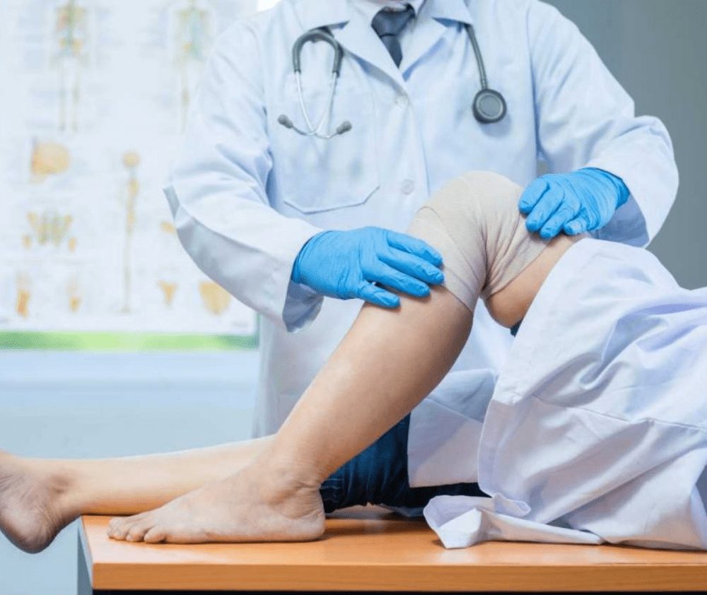 Doctor treating knee pain