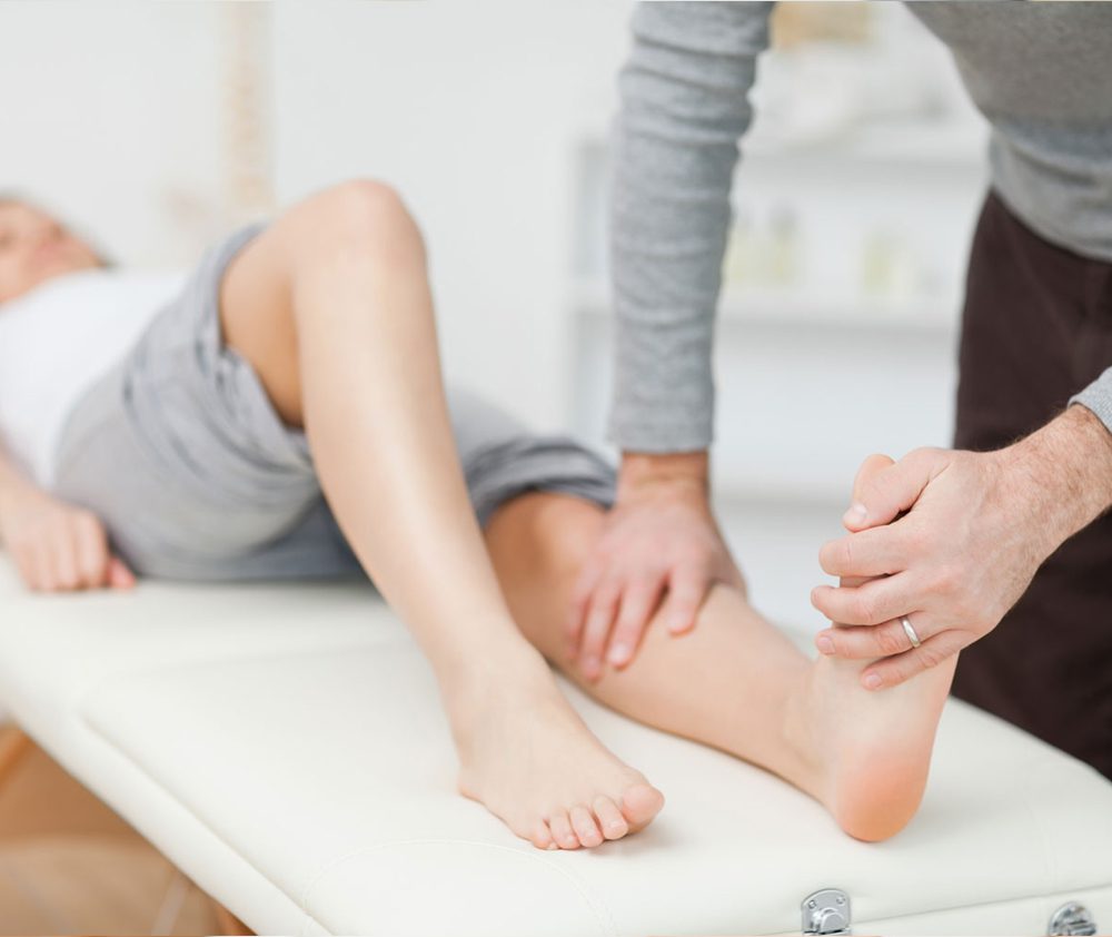 Doctor checking for ankle pain